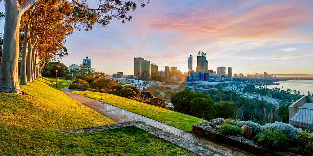 Cityscape of Perth Western Australia as the sun rises over Kings Park