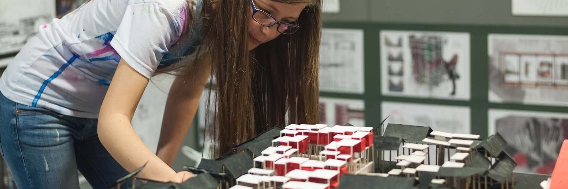 Student working on a building model